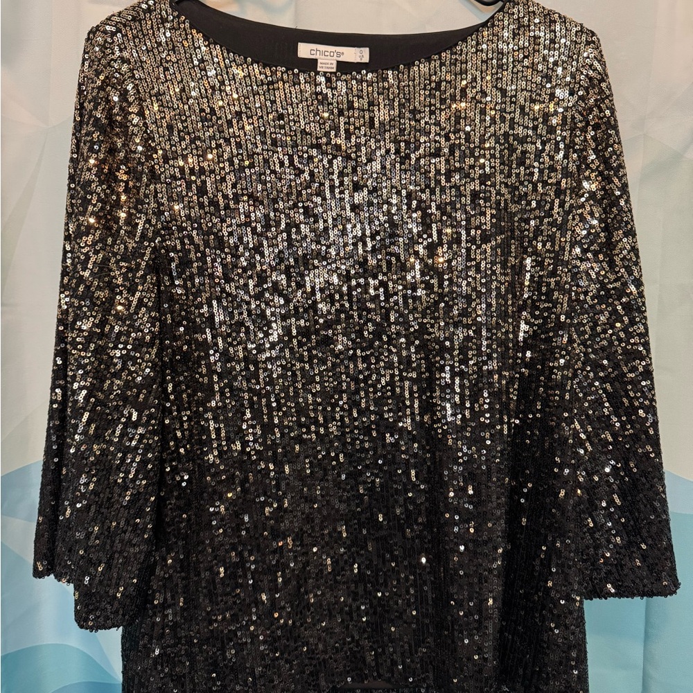 Gold, copper and black sequined top with silky underlay. Very flattering.